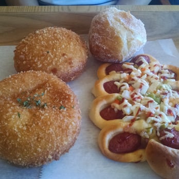 Tous Les Jours - From bottom left clockwise, pork & veggie croquette, curry croquette, cheesy donut, and sausage bread. - Bakeries Near Me - Dublin, California Tous Les Jours - From bottom left clockwise, pork & veggie croquette, curry croquette, cheesy donut, and sausage bread. - Bakeries Near Me - Dublin, California