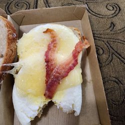 Tasty lookin egg with some bacon scraps!