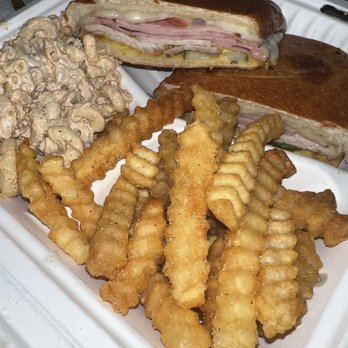 The Roast Beast - a sandwich and french fries on a styrofoam container - Food Trucks Near Me The Roast Beast - a sandwich and french fries on a styrofoam container - Food Trucks Near Me