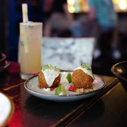 Calle Dao - Bryant Park - Croquetas with creamy topping served with lime and mojito cocktail at Calle Dao Bryant Park Cuban-Chinese fusion restaurant
