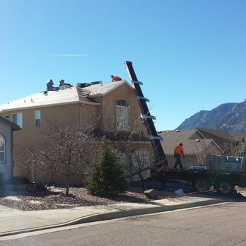Breashears Roofing - Loading Shingles on a Roof - Roofing Near Me Breashears Roofing - Loading Shingles on a Roof - Roofing Near Me