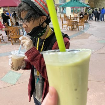 Matcha Boba - my avocado frappe with honey in the foreground and my
friend with a caramel boba (something) which he said was "great!" - Bubble Tea Near Me - Thousand Oaks, California Matcha Boba - my avocado frappe with honey in the foreground and my
friend with a caramel boba (something) which he said was "great!" - Bubble Tea Near Me - Thousand Oaks, California