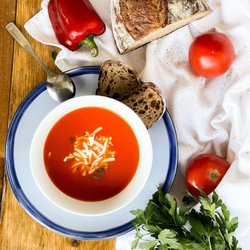 Soupchu | Homemade Soups, Stews & Broths - Tomato Soup - Tomato roasted red bell pepper with shredded mozzarella cheese with Acme bread.