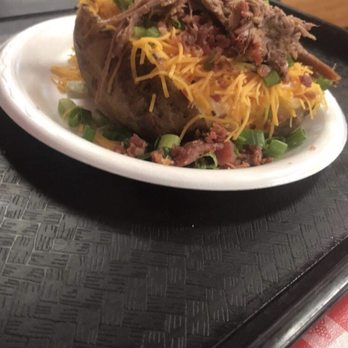 Hog Wild Pit Bar-B-Q - Loaded baked potato with delicious, tender brisket - Fast Food Near Me - Omaha, Nebraska