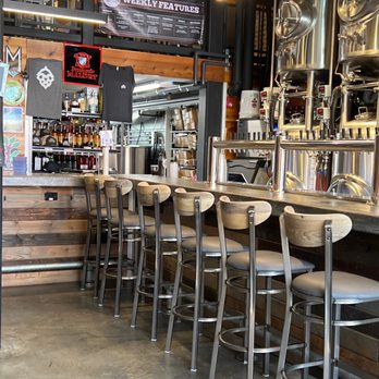 Fiala Brothers - a row of bar stools in a restaurant - Brewpubs Near Me - Normal, Illinois