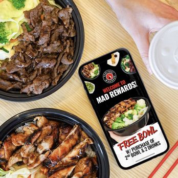 Teriyaki Madness - a hand holding a container of teriyaki - Caterers Near Me - Springfield, Illinois Teriyaki Madness - a hand holding a container of teriyaki - Caterers Near Me - Springfield, Illinois