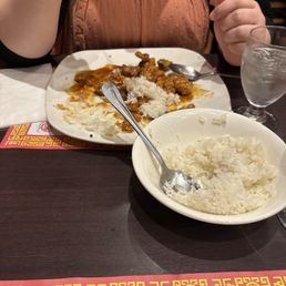 My wife eating rice and honey pepper chicken My wife eating rice and honey pepper chicken