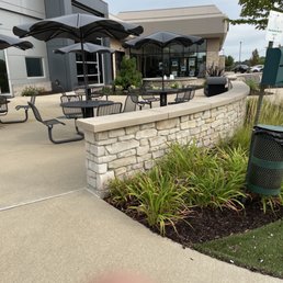 The patio is pet friendly & great place to wait on your car.