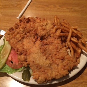 Kincaid Diner - Pork Tenderloin sandwich and fries. The bun is under the huge tenderloin - Diners Near Me - Kincaid, Illinois Kincaid Diner - Pork Tenderloin sandwich and fries. The bun is under the huge tenderloin - Diners Near Me - Kincaid, Illinois