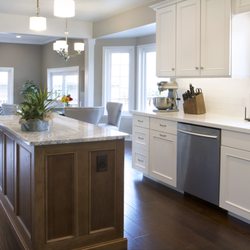 Seelos Design & Construction - By eliminating the wall between the kitchen and family room, we opened up the space to enlarge the kitchen creating a better flow.