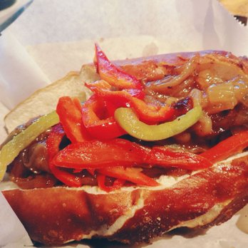Wursthaus - Smoked Cheddar IPA Bratwurst + Pretzel Roll + Sauteed Bell Peppers + Caramelized Onions - Pubs Near Me - Santa Ana, California Wursthaus - Smoked Cheddar IPA Bratwurst + Pretzel Roll + Sauteed Bell Peppers + Caramelized Onions - Pubs Near Me - Santa Ana, California