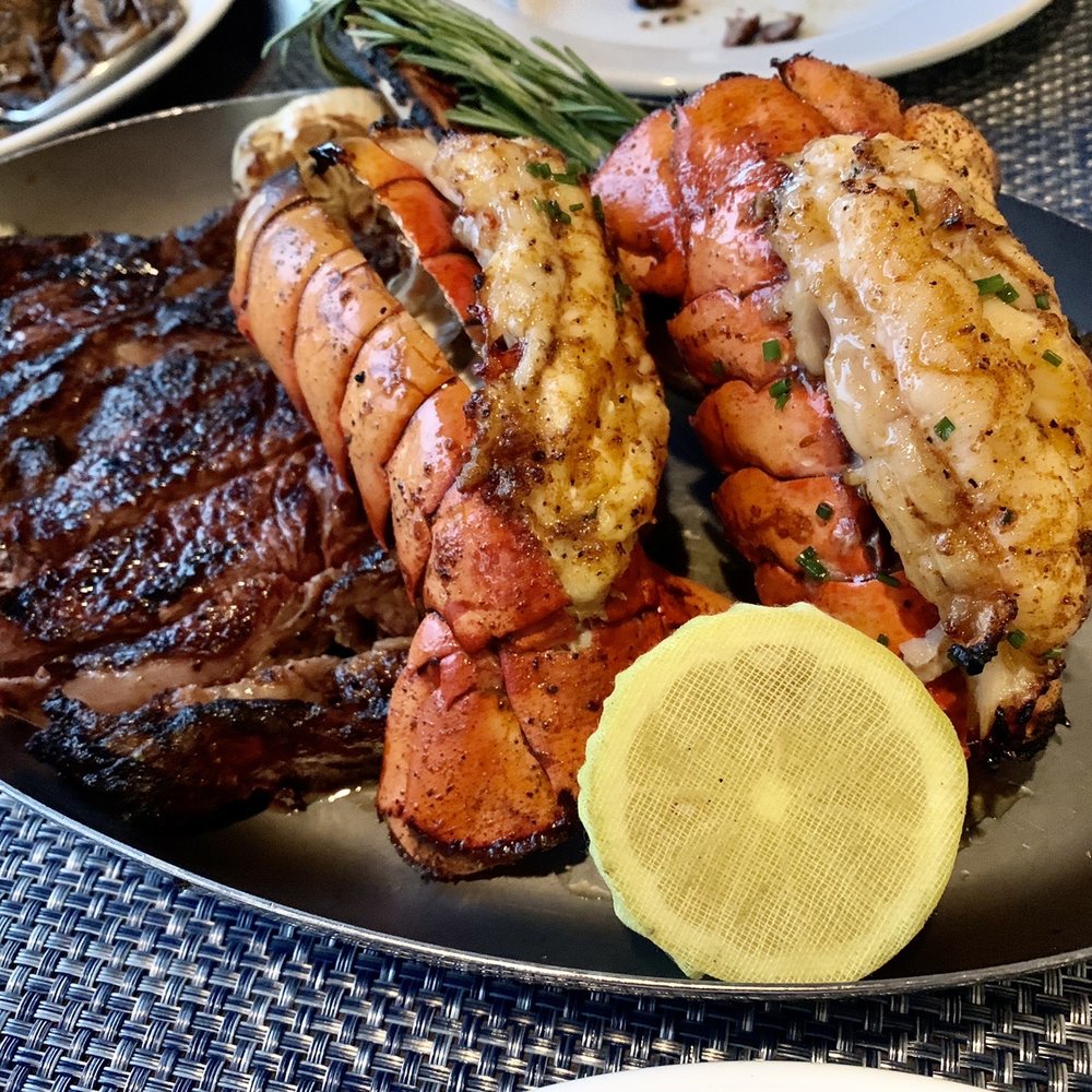 Bottles & Bones - 32oz Tomahawk Ribeye w/ 2 lobster tails - Bars Near Me - Suwanee, Georgia Bottles & Bones - 32oz Tomahawk Ribeye w/ 2 lobster tails - Bars Near Me - Suwanee, Georgia