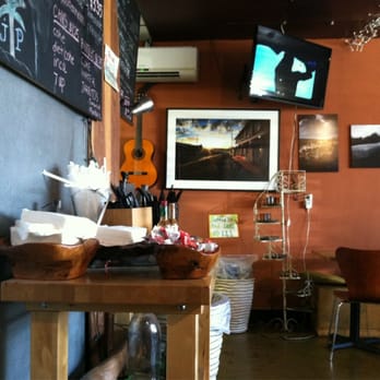 Johnny Pacific - The counter with surfing photos, paints, and documentary. - Latin American Near Me - Winnetka, California