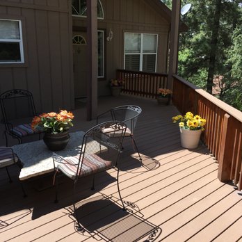 Ascent builders - a deck with chairs and a table - General Contractors Near Me - Ruidoso, New Mexico