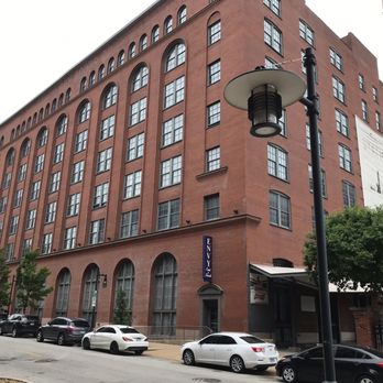 Stadium Lofts - Historic Romanesque Revival warehouse architecture, distinguished by its arched windows and massive red brick façade. - Apartments Near Me - Saint Louis, Missouri Stadium Lofts - Historic Romanesque Revival warehouse architecture, distinguished by its arched windows and massive red brick façade. - Apartments Near Me - Saint Louis, Missouri