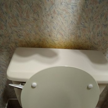 GuestHouse Poulsbo - Brown stuff on wall behind toilet - Hotels Near Me - Poulsbo, Washington