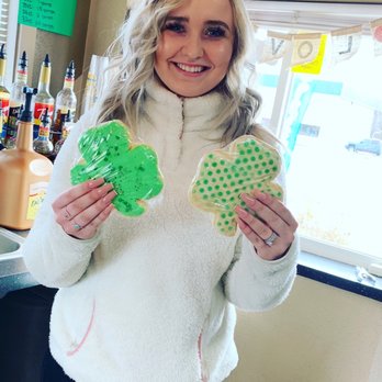 Black Sheep Coffee - a woman holding two cookies - Coffee & Tea Near Me - Spokane Valley, Washington Black Sheep Coffee - a woman holding two cookies - Coffee & Tea Near Me - Spokane Valley, Washington