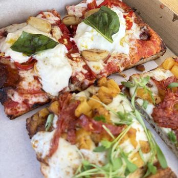 Sugo - Top: Baby boy (garlic, mozz, fresno peppers, straciatella, basil) Bottom: Yo Momma (pineapple sugo, calabrese, mozz, herbs, pineapple) - Pizza Near Me - Costa Mesa, California Sugo - Top: Baby boy (garlic, mozz, fresno peppers, straciatella, basil) Bottom: Yo Momma (pineapple sugo, calabrese, mozz, herbs, pineapple) - Pizza Near Me - Costa Mesa, California