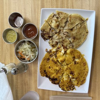 Sarah's Empanadas - My dish: sweet corn Arepa (left side of plate), pork & cheese Pupusa (right side of plate) - Empanadas Near Me - Durham, North Carolina Sarah's Empanadas - My dish: sweet corn Arepa (left side of plate), pork & cheese Pupusa (right side of plate) - Empanadas Near Me - Durham, North Carolina