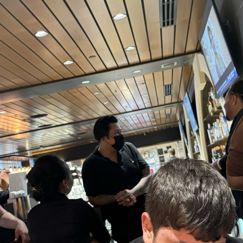 Employees just standing around while we have empty drinks on our table. Employees just standing around while we have empty drinks on our table.