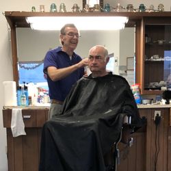 Rex's Barber & Style - Barber and customer in the chair.