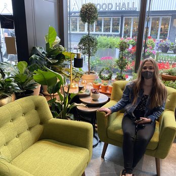 Chlorophyll by Kinghorn Gardens - My sister enjoying the seating area - Nurseries & Gardening Near Me - Omaha, Nebraska