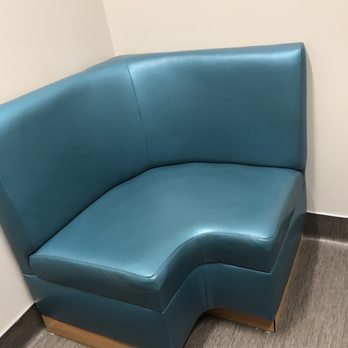 Next Level Urgent Care - Conroe - The waiting chair in the room is actually a nice piece of couch! - Urgent Care Near Me - Conroe, Texas