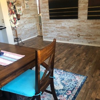 San Diego Flooring Express - a dining room with a wood table and blue chairs - Flooring Near Me San Diego Flooring Express - a dining room with a wood table and blue chairs - Flooring Near Me