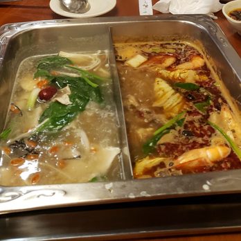 Chuan Yu Hot Pot - Beef broth on the left and spicy oil on the right - Hot Pot Near Me - Suwanee, Georgia