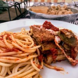 a plate of spaghetti and meat
