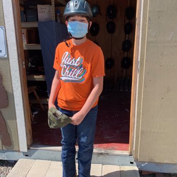 Cloverleaf Ranch - Getting boots and helmet from the ranch for riding. - Horseback Riding Near Me - Santa Rosa, California