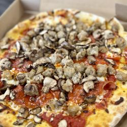 California Pizza Kitchen - Mushroom, sausage, & pepperoni pizza - This was so good at the airport.