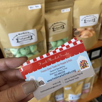 Fresh Market Treats - a person holding a business card - Candy Stores Near Me - Muncie, Indiana