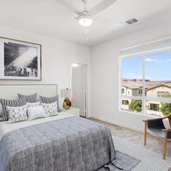 Enclave Heritage - Cozy bedroom with natural lighting.