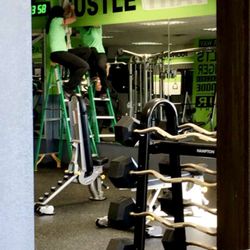 Freebs Fitness &Tanning - The owner putting up more lettering for motivation.