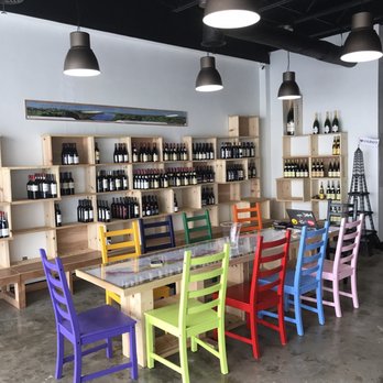 Le Caveau Vinotheque - colorful chairs and tables - Beer, Wine & Spirits Near Me - Dallas, Texas Le Caveau Vinotheque - colorful chairs and tables - Beer, Wine & Spirits Near Me - Dallas, Texas