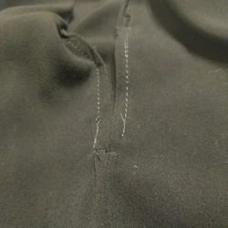 Professional Cleaners - Open/unfinished hem on side slit