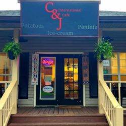 C&J International Cafe - Cafe front porch w/ brand new vinyl sign made by Peggysue Sampson