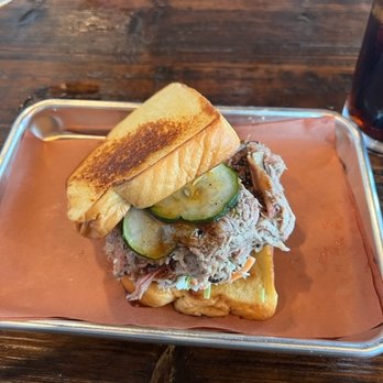 Apocalypse BBQ - pulled pork sandwich with pickles and slaw - Food Trucks Near Me - Miami, Florida