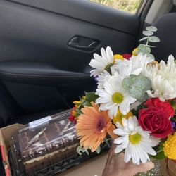 Costco Wholesale - Beautiful flowers and delicious tuxedo cake.