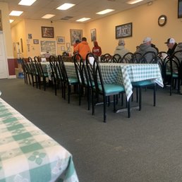 a dining room with tables and chairs a dining room with tables and chairs