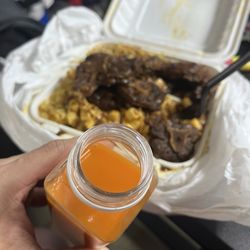 Cherry's Jamaican Delight - The carrot ginger drink and oxtail with mac and cheese and steamed seasoned cabbage mix