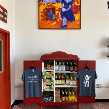 Puerto Rico Distillery - a painting of a woman in a blue dress - Distilleries Near Me - Brunswick, Maryland Puerto Rico Distillery - a painting of a woman in a blue dress - Distilleries Near Me - Brunswick, Maryland
