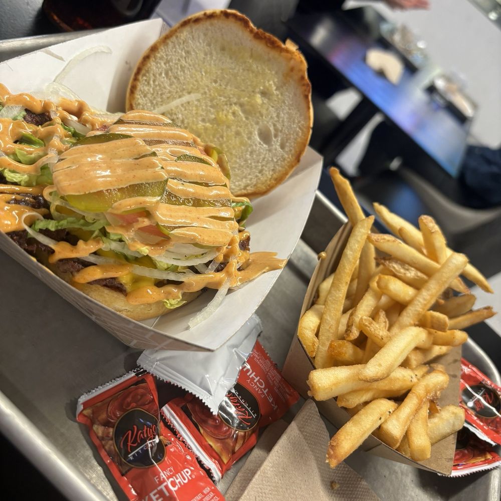 a tray of fries and a sandwich a tray of fries and a sandwich