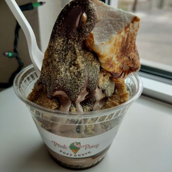Pink Pony Soft Serve - Chocolate and vanilla swirl soft serve ice cream topped with a cookie and a slice of bread, served in a clear cup with a logo. - Ice Cream & Frozen Yogurt Near Me - Albuquerque, New Mexico
