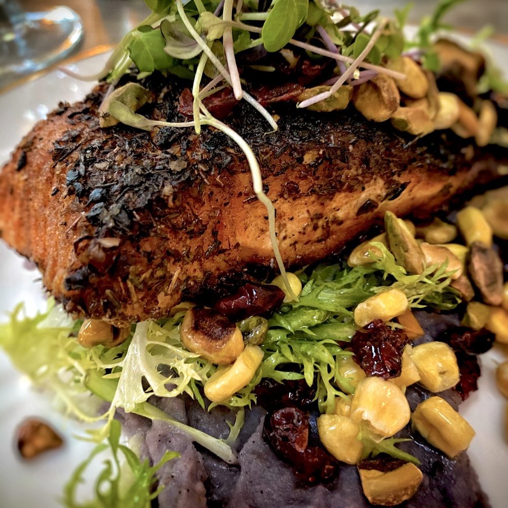 The West End - Blackened Faroe Island Salmon. Purple potatoes, frisée and corn cranberry salad. So beautiful! And delicious! - New American Near Me - Hyannis, Massachusetts The West End - Blackened Faroe Island Salmon. Purple potatoes, frisée and corn cranberry salad. So beautiful! And delicious! - New American Near Me - Hyannis, Massachusetts
