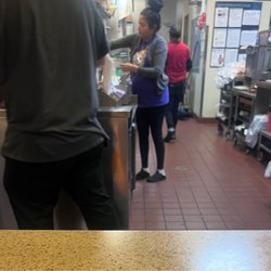 Jack in the Box - I walked in to pick up food and this employee doesn't even have her shoes on correctly. Super disgusting , unprofessional and unsanitary.
