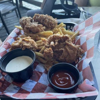 Sam's - Blue Turtle Bay - Fried chicken tenders with French fries and a side salad in the background. - Sports Bars Near Me - Old Hickory, Tennessee