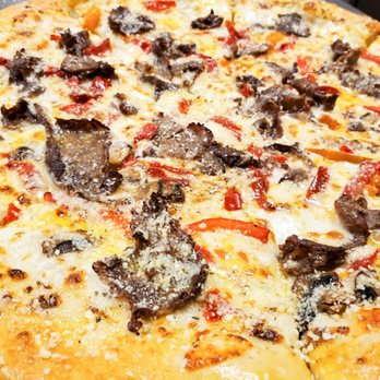 Macs Pizza & Wings - a close up of a pizza - Pizza Near Me - Newnan, Georgia Macs Pizza & Wings - a close up of a pizza - Pizza Near Me - Newnan, Georgia