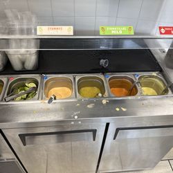 El Serranito Taqueria - Salsa bar with napkins and plastic utensils just out of the picture to the right
